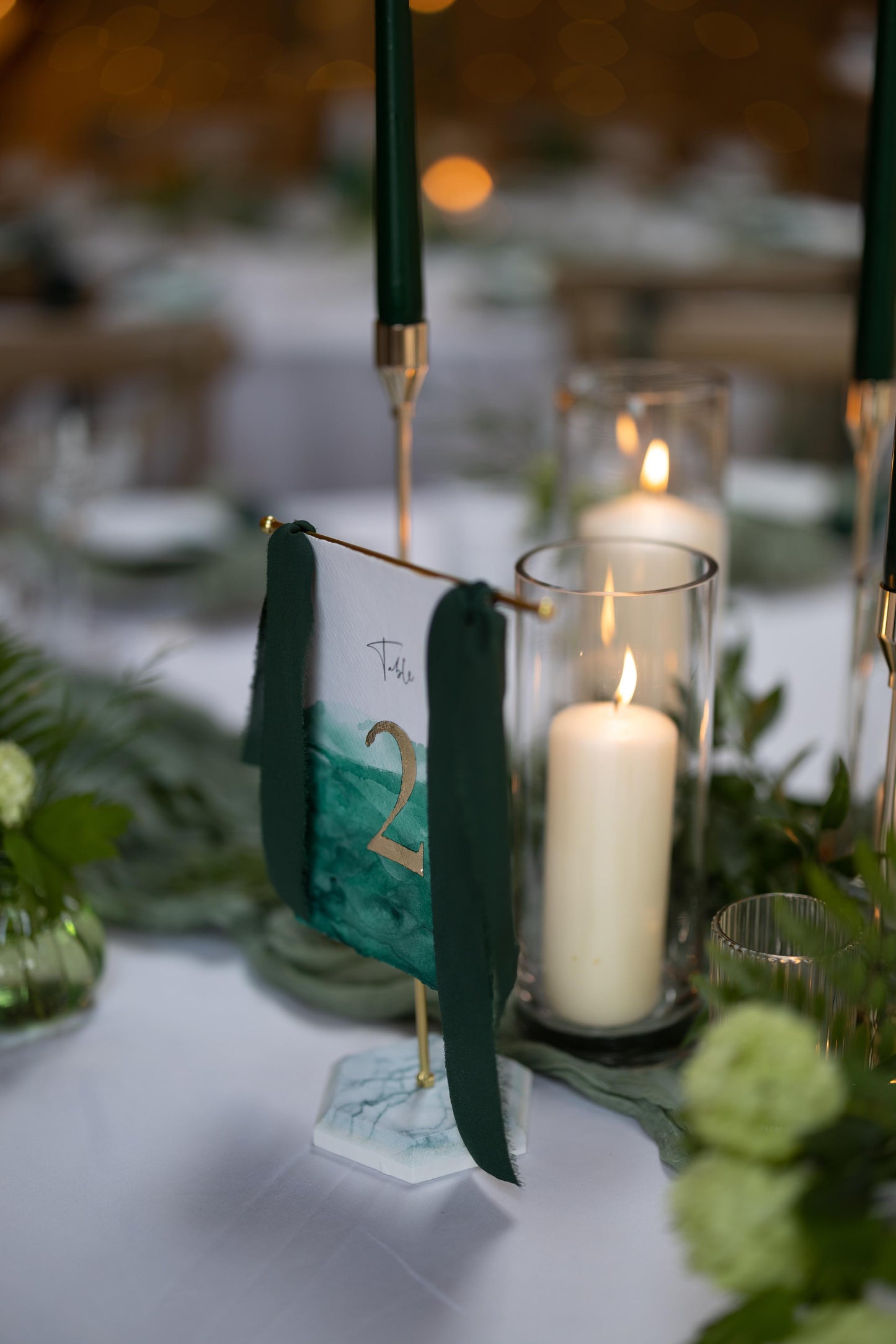 Hand painted hanging table numbers in Green and Gold