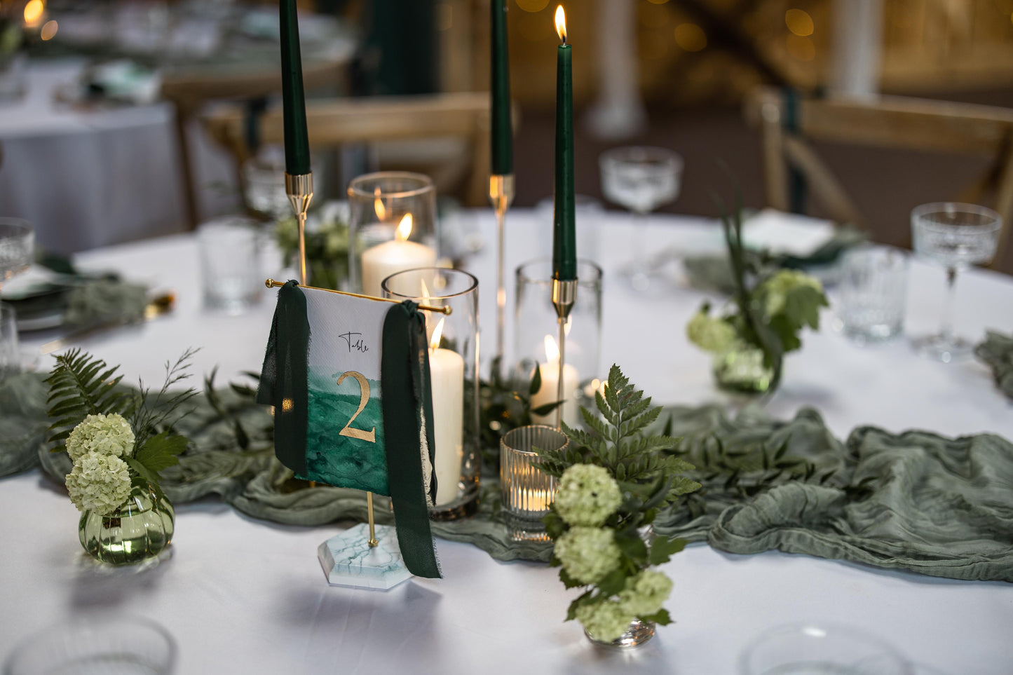 Hand painted hanging table numbers in Green and Gold