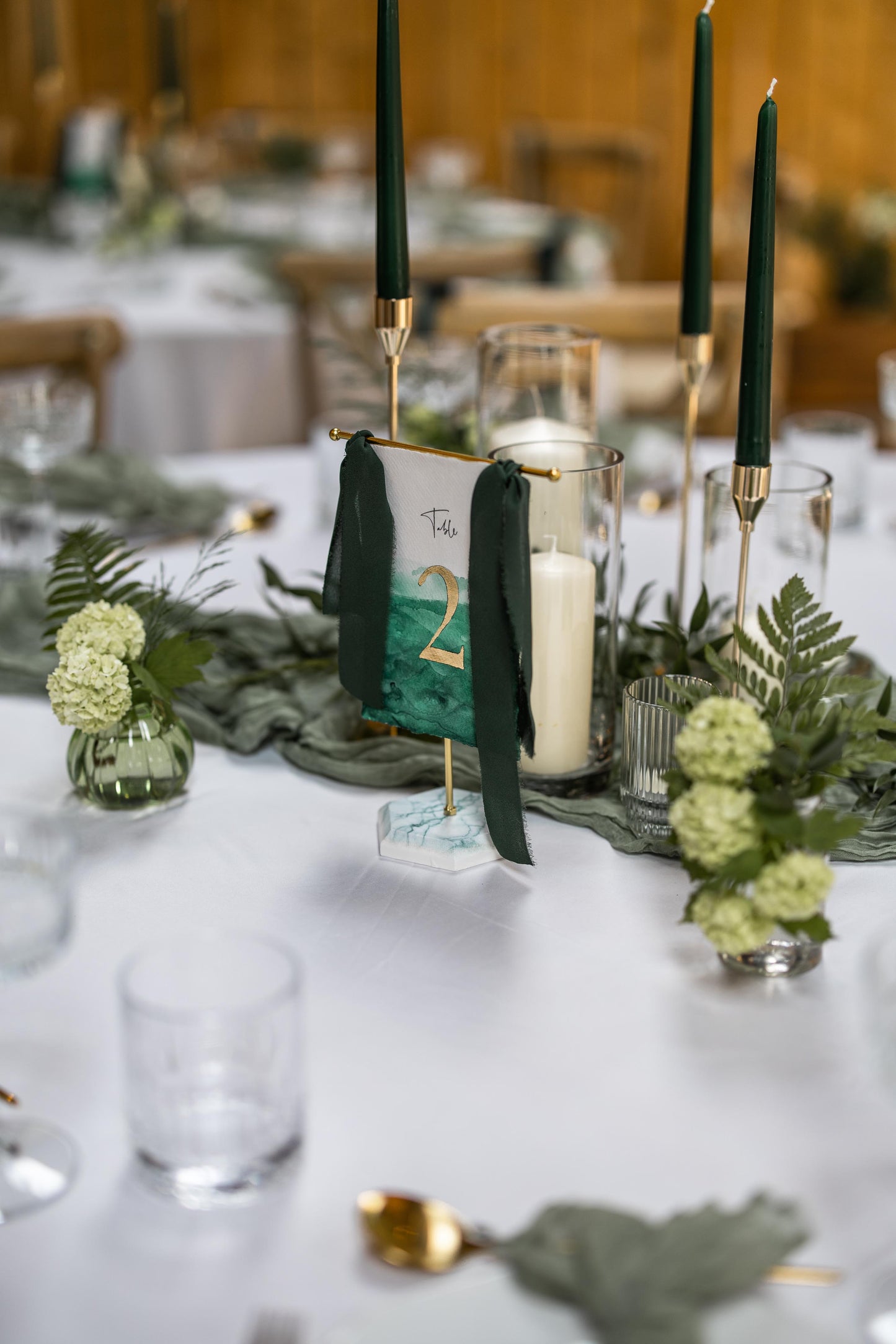 Hand painted hanging table numbers in Green and Gold